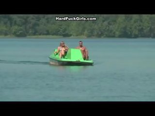 Titted blonde fucked hard in a boat by two studs