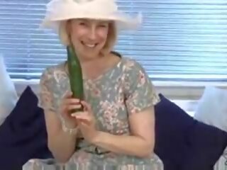 Ripened housewife fucks a cucumber