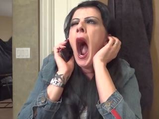 Michelle Vince yawning on the phone