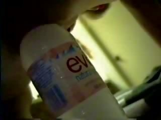 A bottle of purified water brings her to orgasm clip
